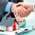 Real estate agent consulting with clients during a property transaction in San Diego